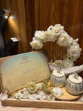 White floral themed invitation card and hamper