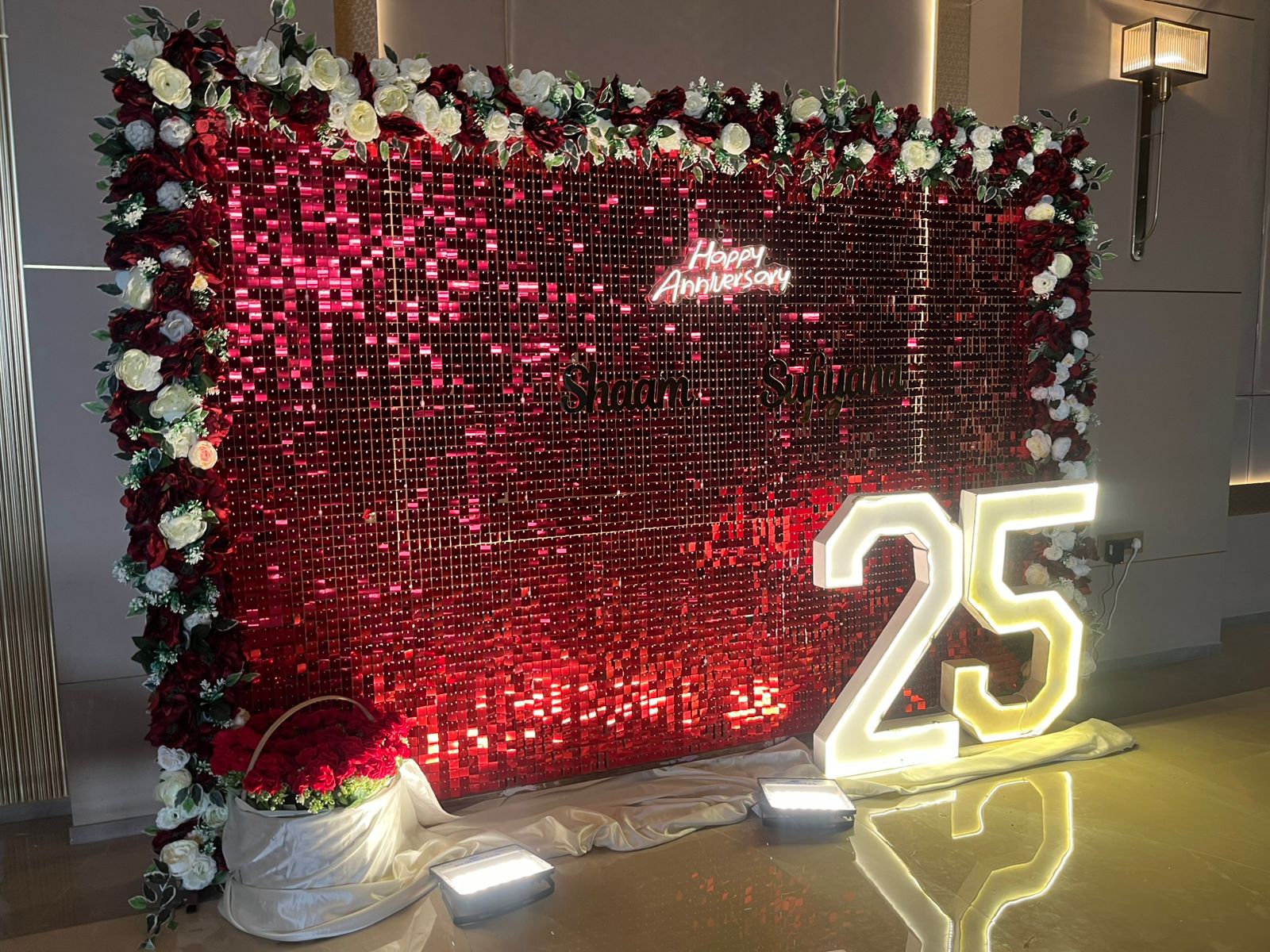 Happy anniversary floral backdrop with letter neon
