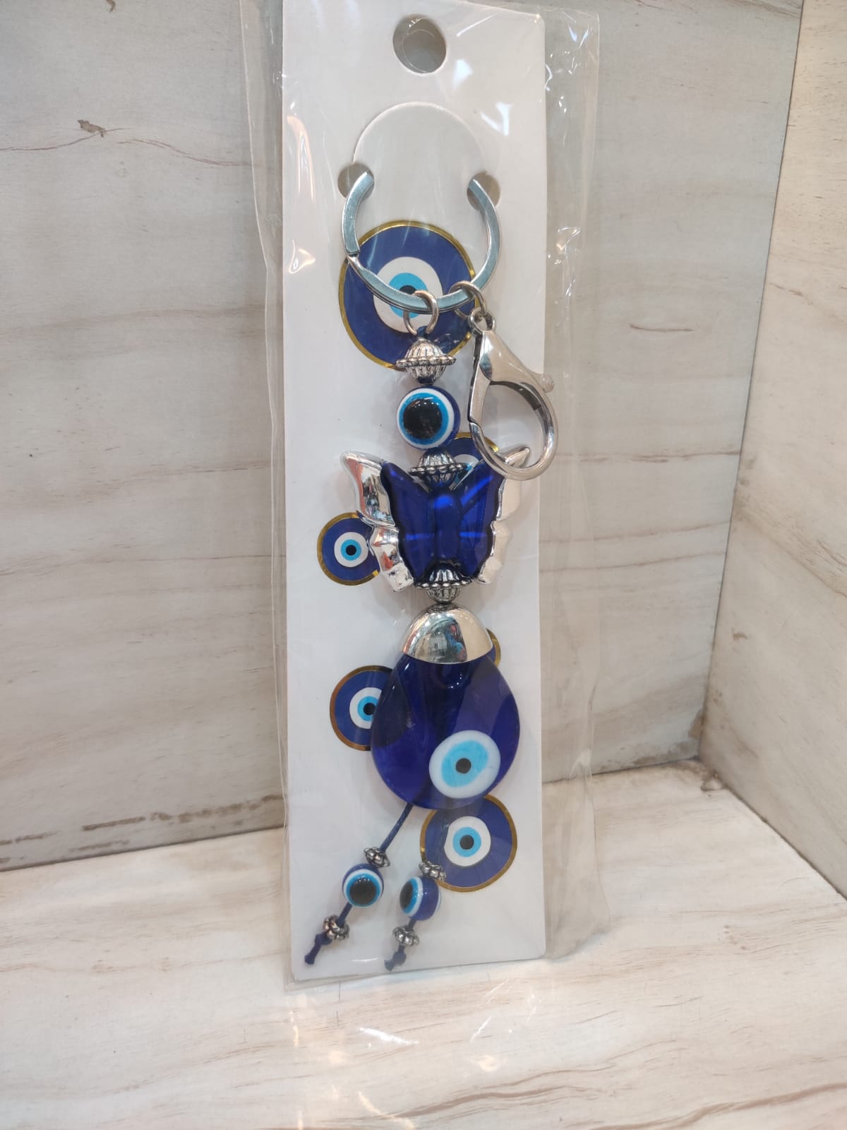 Evil eye keychain with butterfly